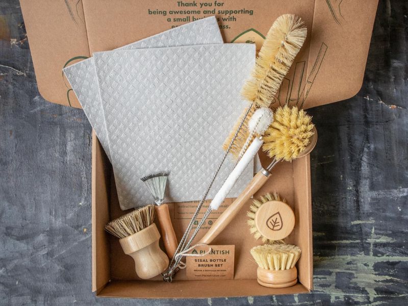 Zero waste kitchen brush set with 7 brushes and 2 reusable cloths.