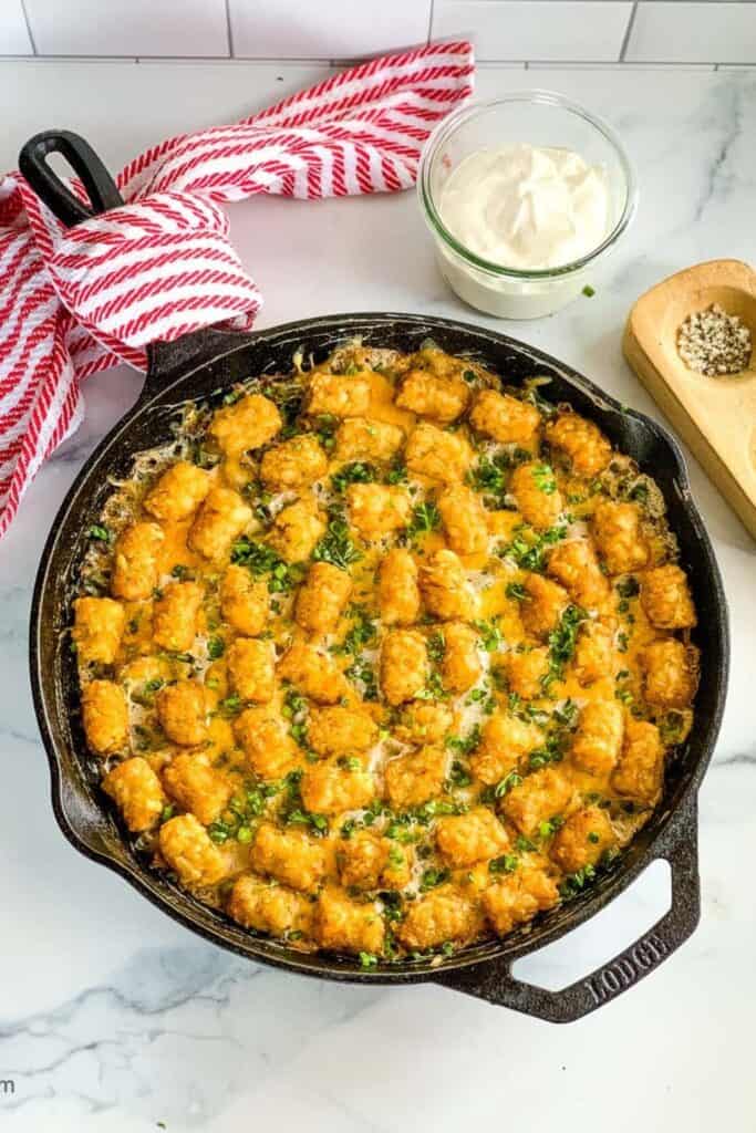 Cast iron pan with chicken tortilla casserole. 